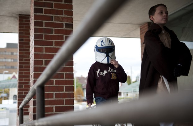 Gauge, five, and Lance, 11, Richard walk into the Ann Arbor District Library for the Inaugural Star Wars Read Day on Saturday. This was a national event celebrated in more than 1,200 bookstores and libraries around the country. Daniel Brenner I AnnArbor.com